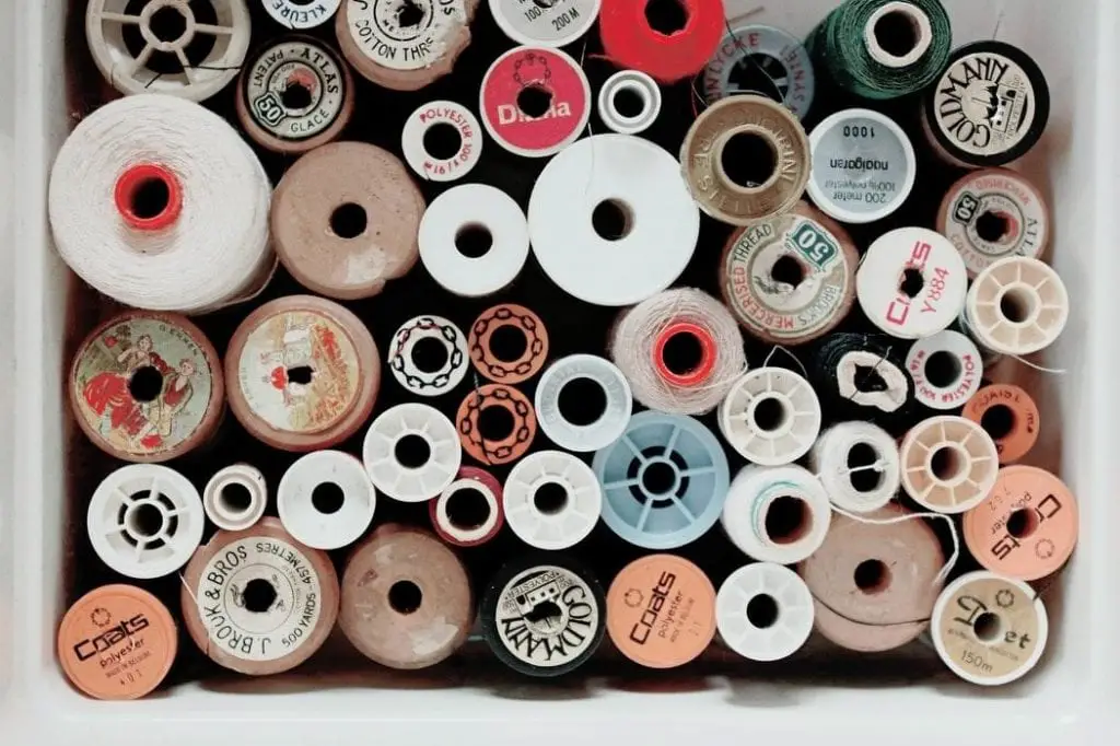 A box full of threads of different colors and sizes.