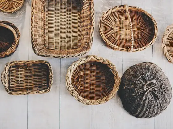 A bunch of wooden baskets with attractive and irregular pattern in their bases